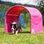 Callieway pink Hoopers dog agility tunnel with dog running through the tunnel on a grassy training field.